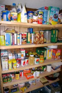 pantry shelves full of canned and boxed foods
