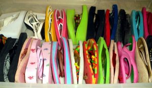 colorful flip flop shoes lined up on their sides in two rows