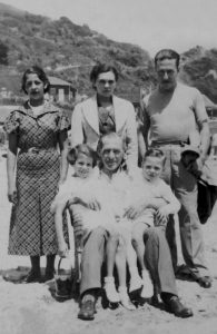 family photo including my grandfather, grandmother, mom, uncle, and two unknown people