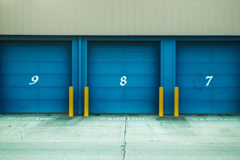 three blue storage unit doors